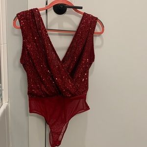 Ruby sequin tank with a scoop back.